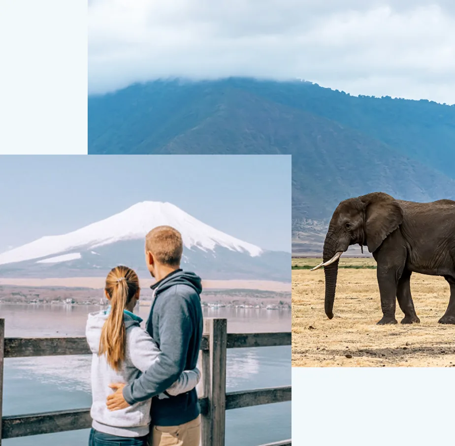 Daniel und Jessi stehen am See und schauen auf einen schneebedeckten Berg, daneben läuft ein Elefant in einer weiten Landschaft